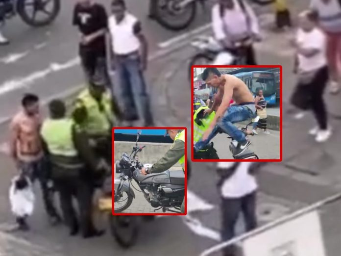 'Están violando y esperando que no hagan nada', el motociclista cruzaba el carril MIO, 'peleó' con la policía y le gritaron 'no le peguen'