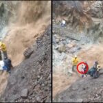 Peligroso cruce con un niño por la violenta cascada, en el resguardo indígena Río Blanco en Sotará, Cauca